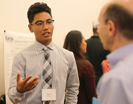 High school student at poster session
