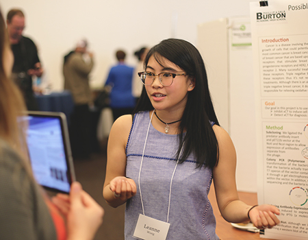 High school student at poster session